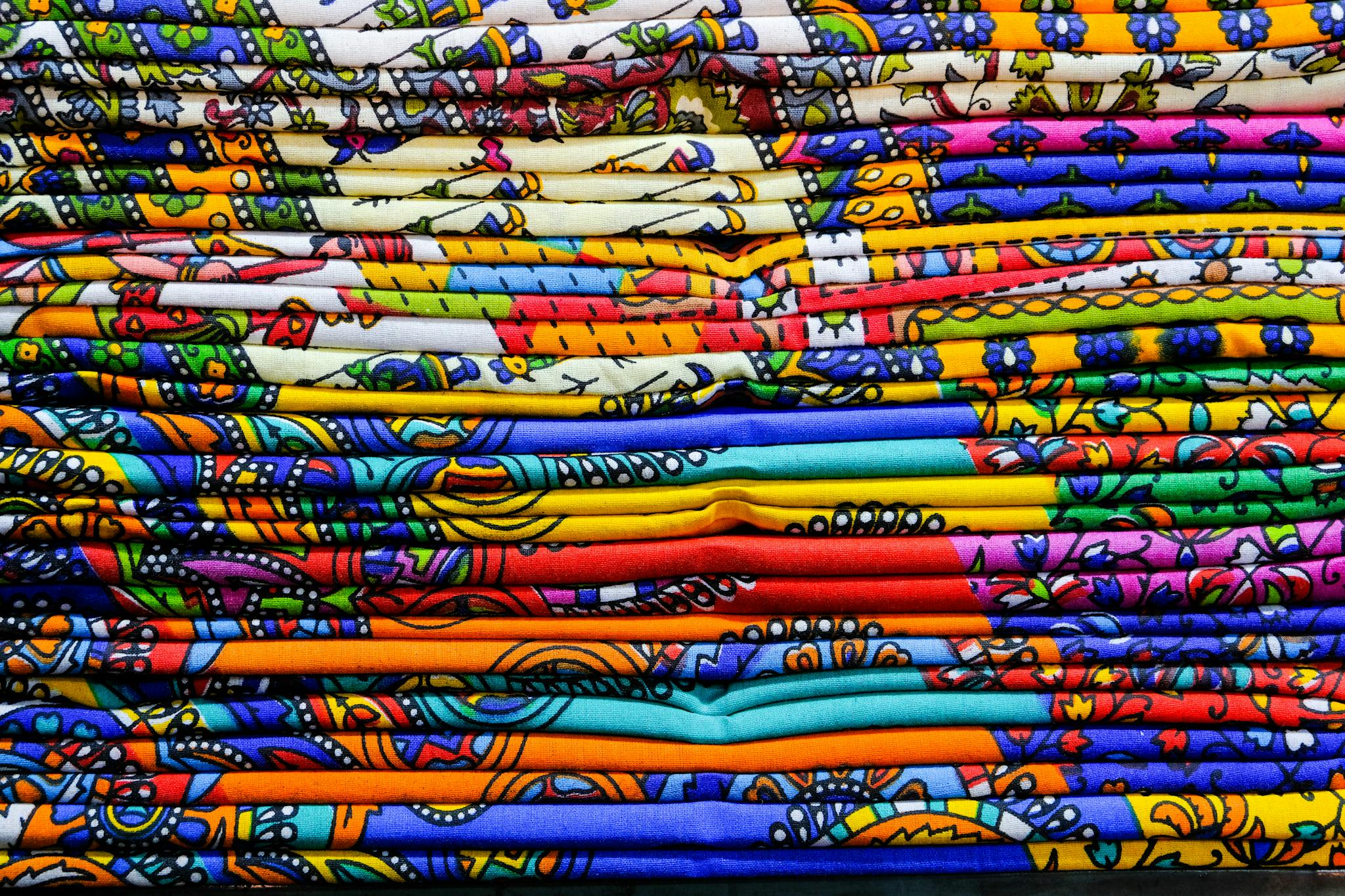 Close-up of colorful Indian textiles showcasing traditional patterns in Jaipur, India.
